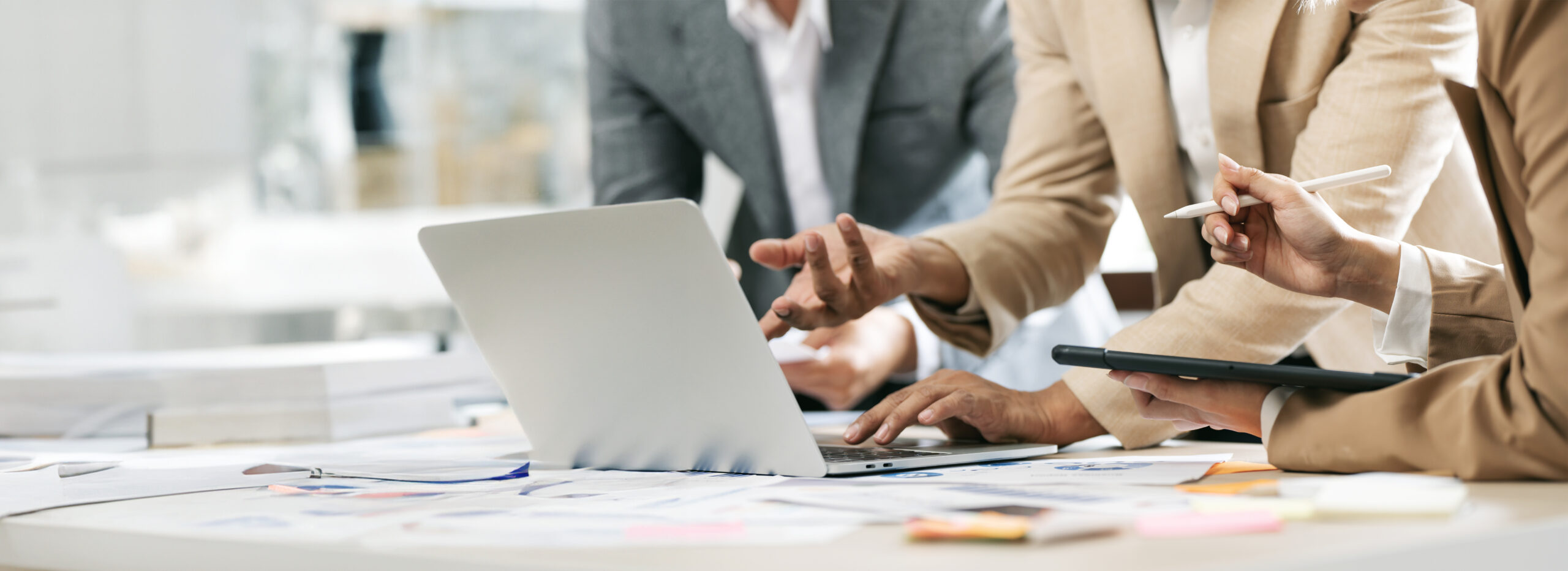Cropped shot of diverse coworkers working together in boardroom, brainstorming, discussing and analyzing business strategy.